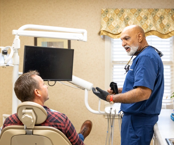 Dentist explaining at-home care to patient