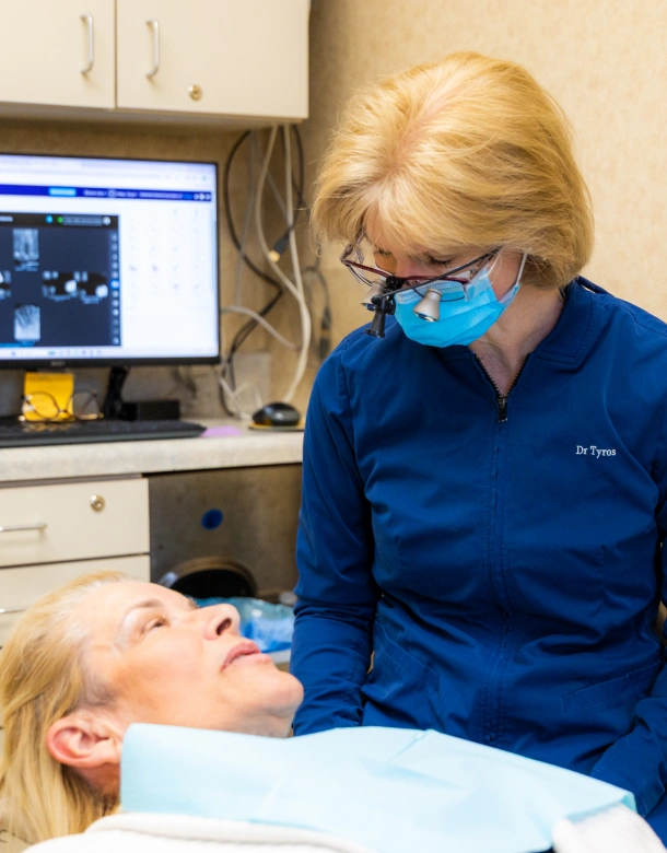 Dentist examining patient during dental exam