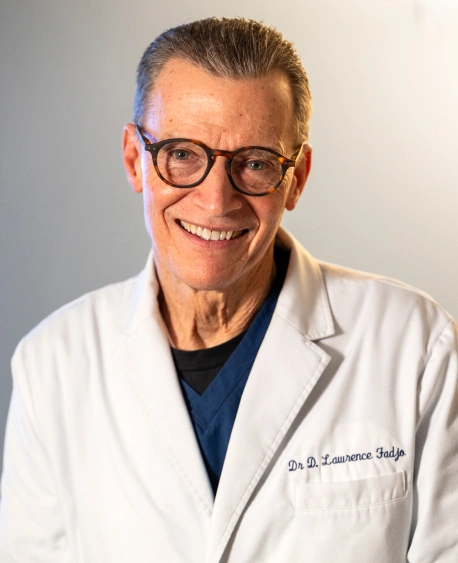 Portrait of Dr. Lawrence Fadjo smiling in a white coat