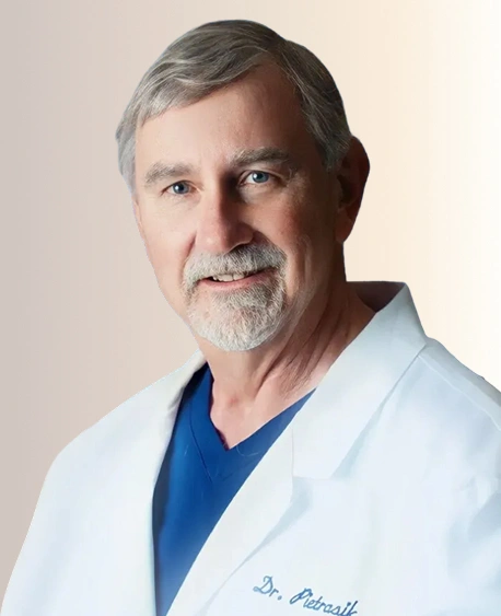 Portrait of Dr. Pietrasik smiling in a white coat