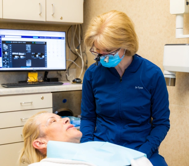 Dentist examining patient during dental exam